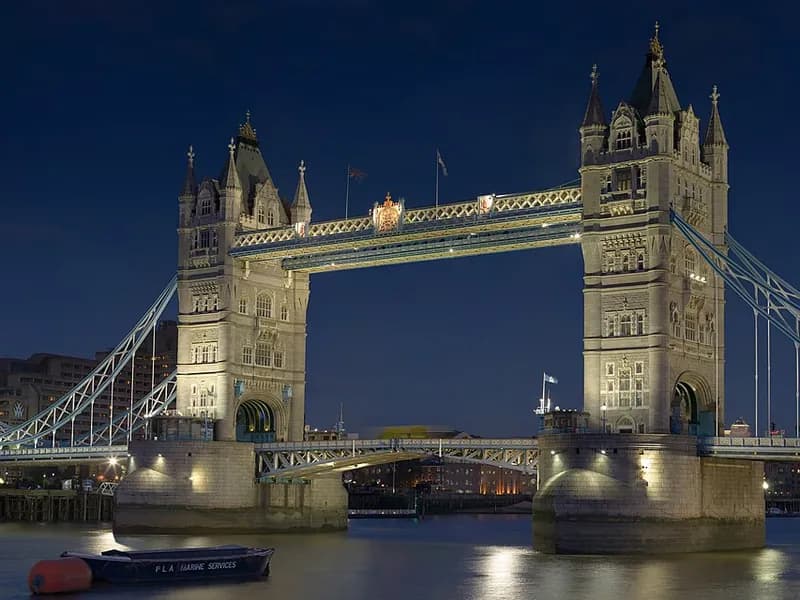 Tower Bridge lit up over the River Thames at dusk