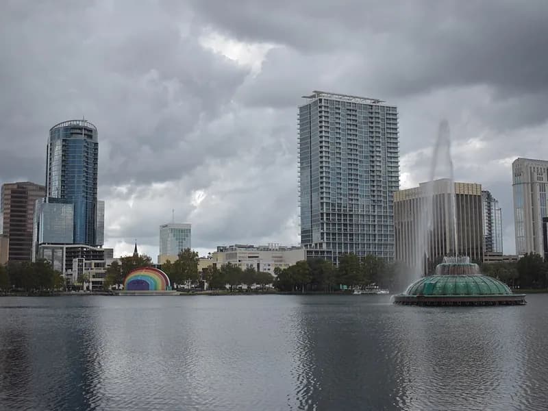 Lake Eola fountain in front of the downtown Orlando skyline